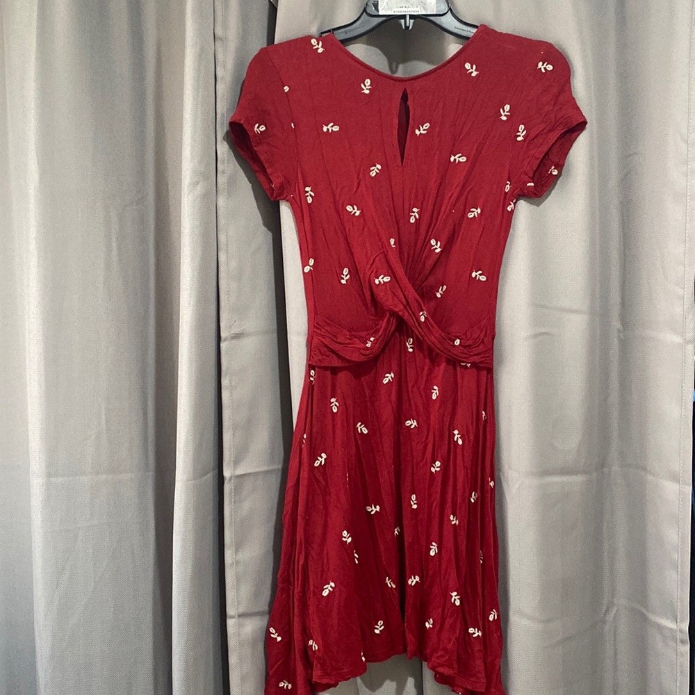Red dress with cream embroidered flowers